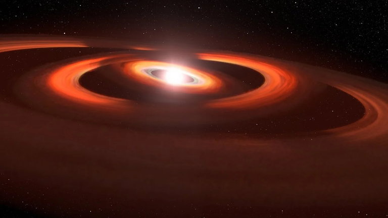 Este sistema estelar detectado por el telescopio Hubble de la NASA se divierte con un 'teatro de sombras'